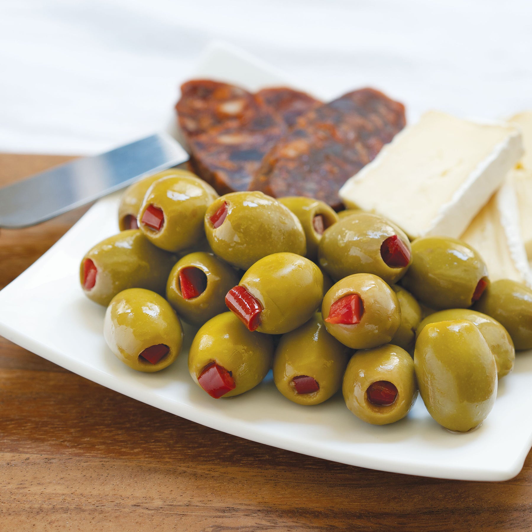 Red Pepper Stuffed Olives  Shop Divina Food Products
